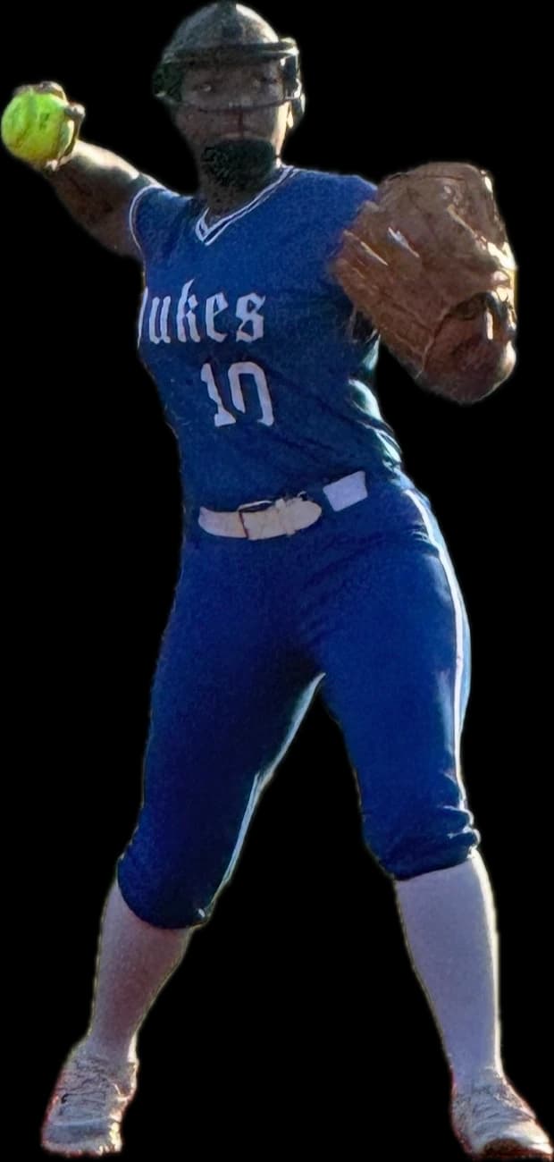 Kennedi Fair making a throw from behind the plate.